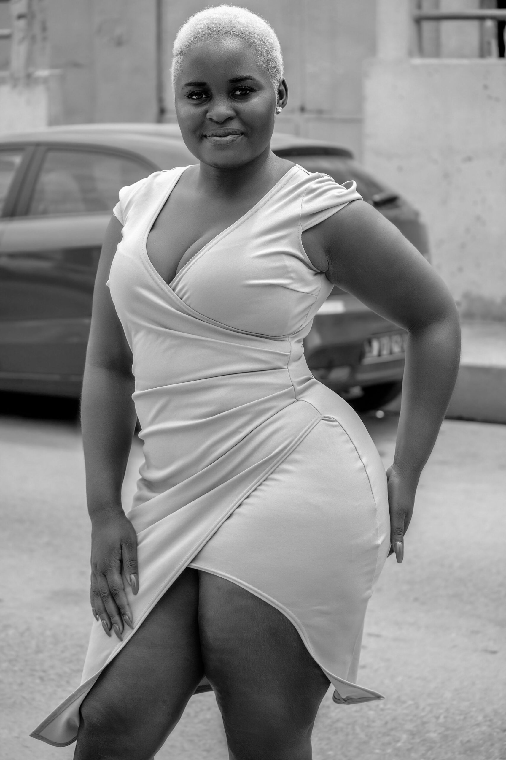 Black-and-white portrait of a woman in a wrap dress